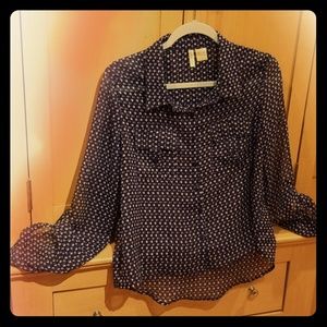 Sheer blouse with button details.